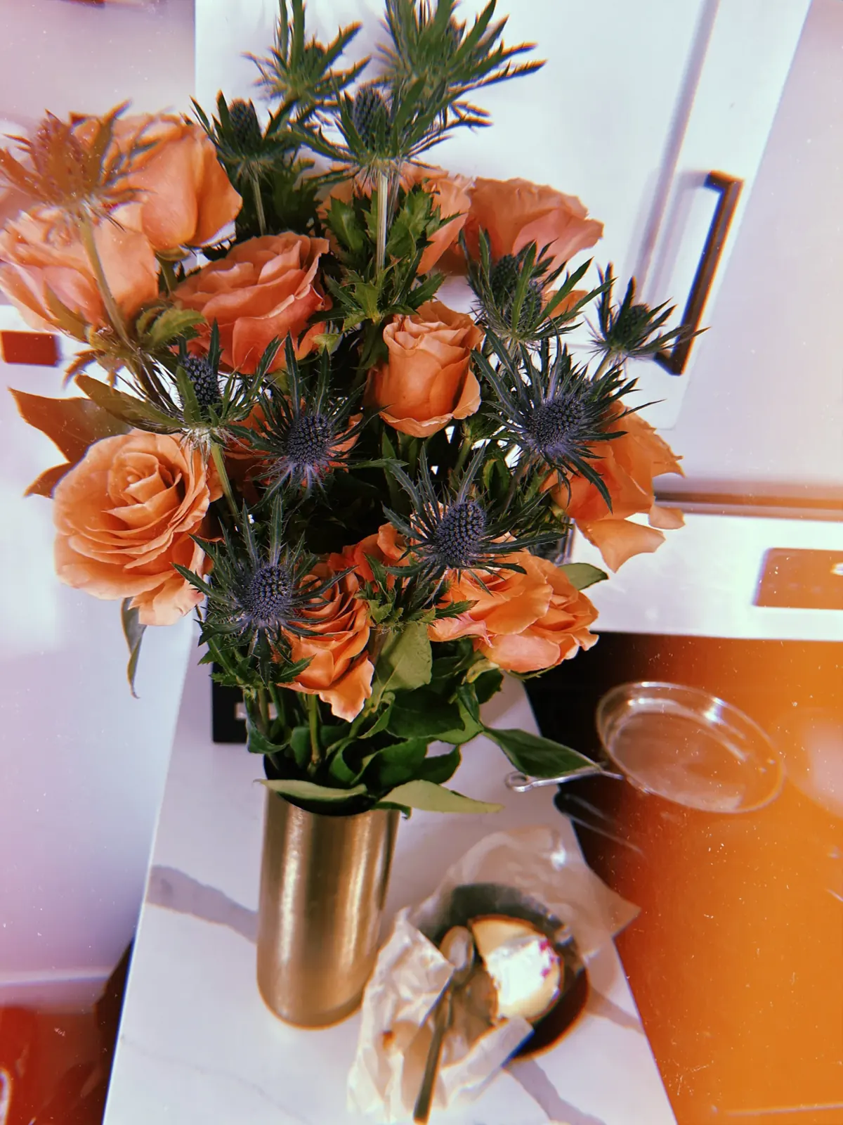 Peach roses with thistle